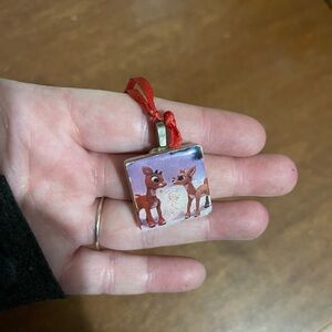 Glass pendant of Rudolph, the red nose, reindeer necklace
On red string